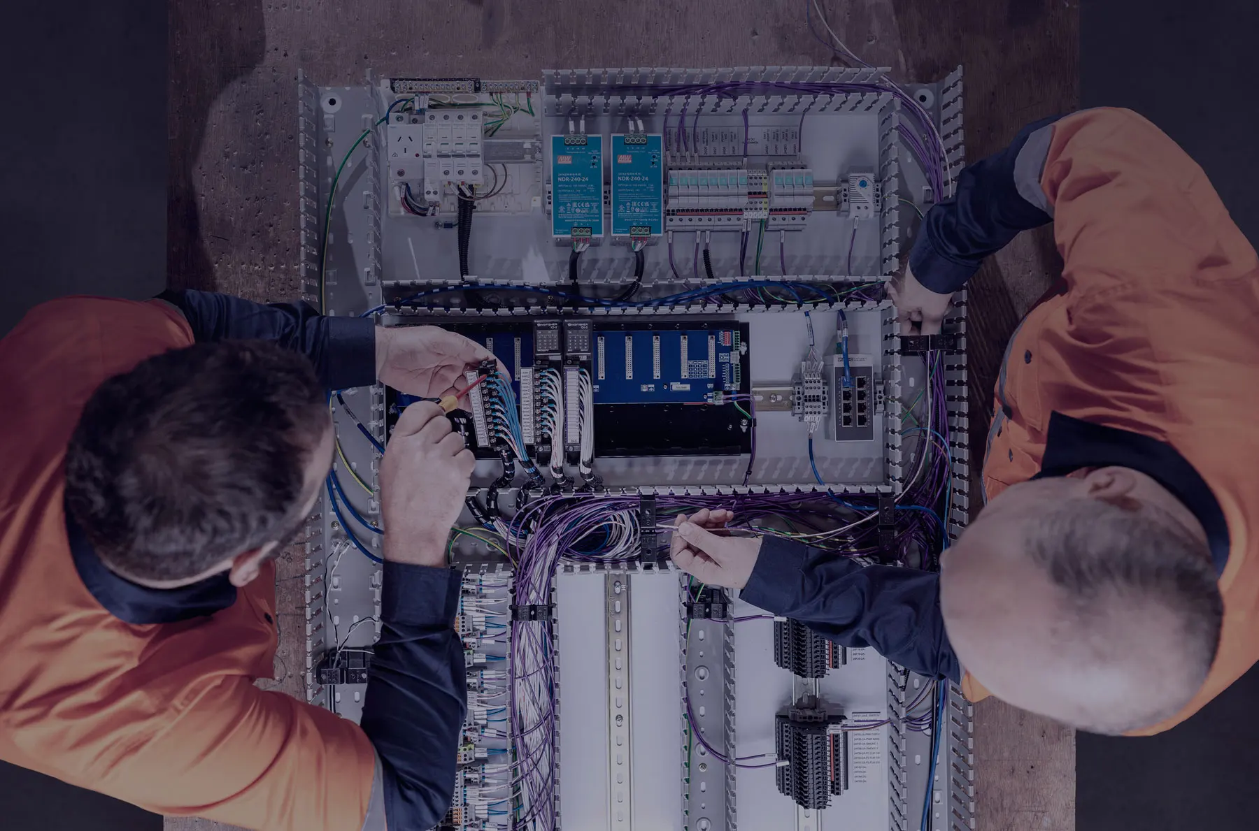 EDSS electricians installing or inspecting electrical and data cabling on site for commercial and industrial services