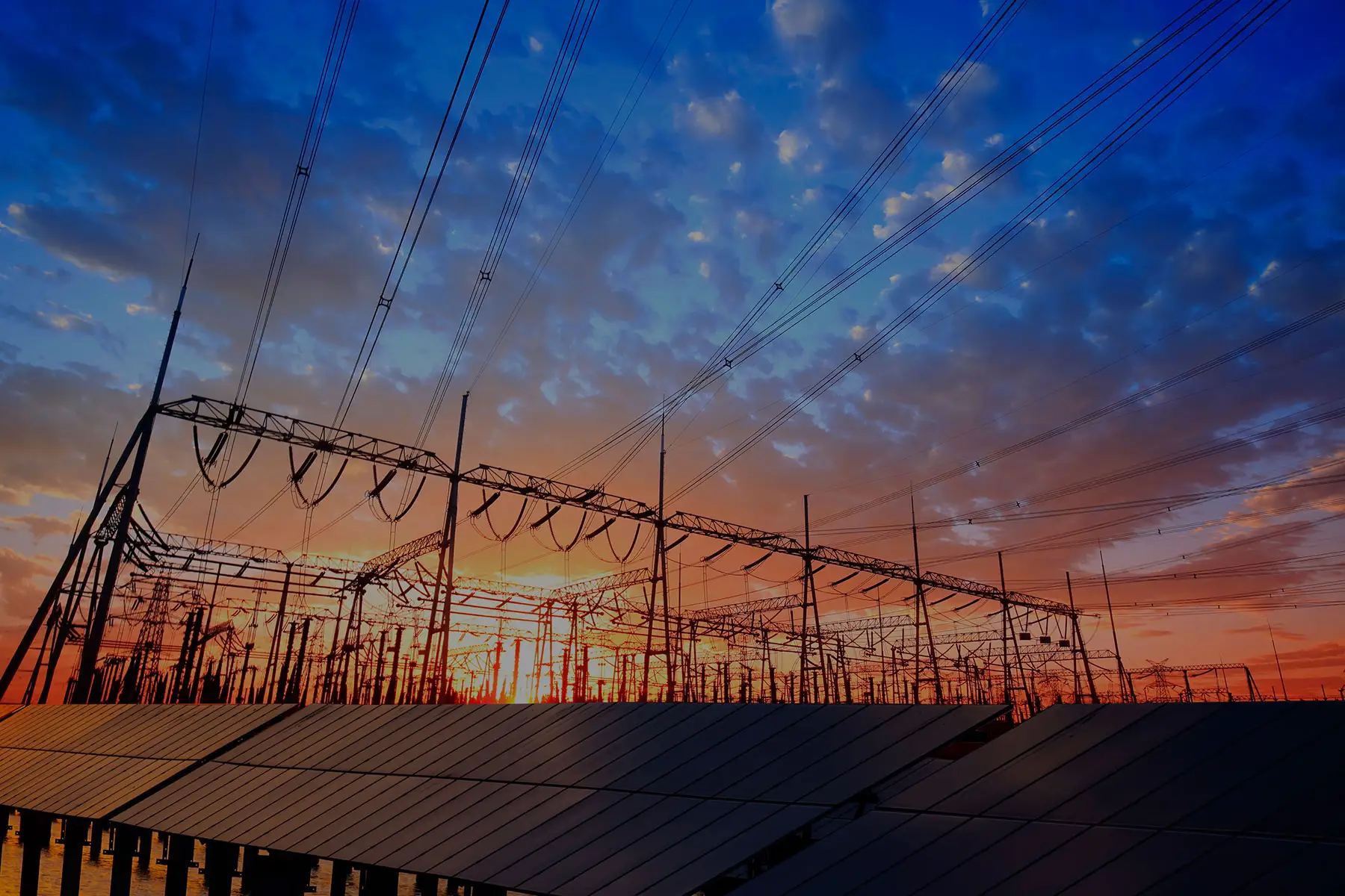 Solar photovoltaic panels and substations in the evening