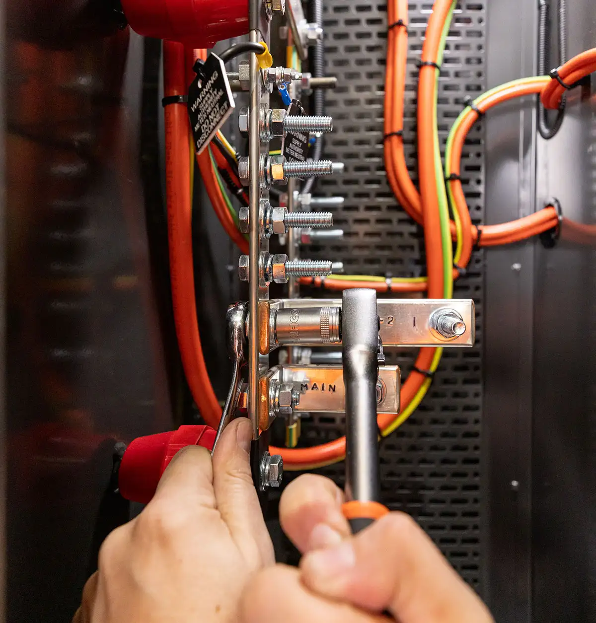 electrician installing electrical infrastructure during a service job